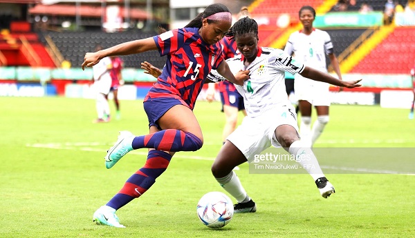 Trinity Byars of USA and Ghana's Rebecca Atinga compete for the ball in the Group D opener
